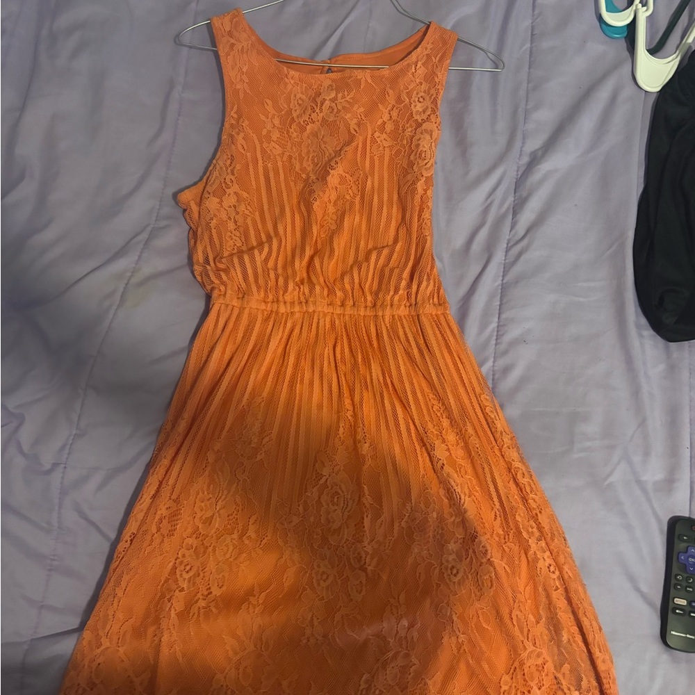 small peach color dress.